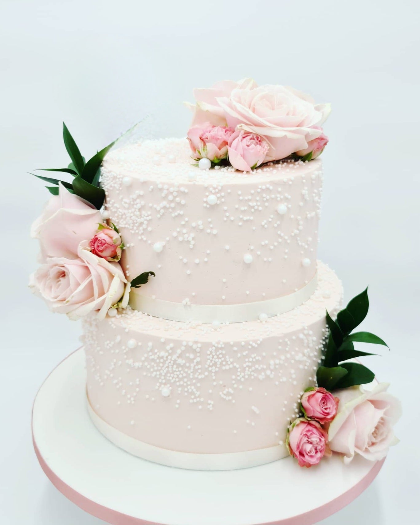 Romantic Elegance Pink Wedding Cake Adorned With Pearls and Fresh Flowers - Cake Secret