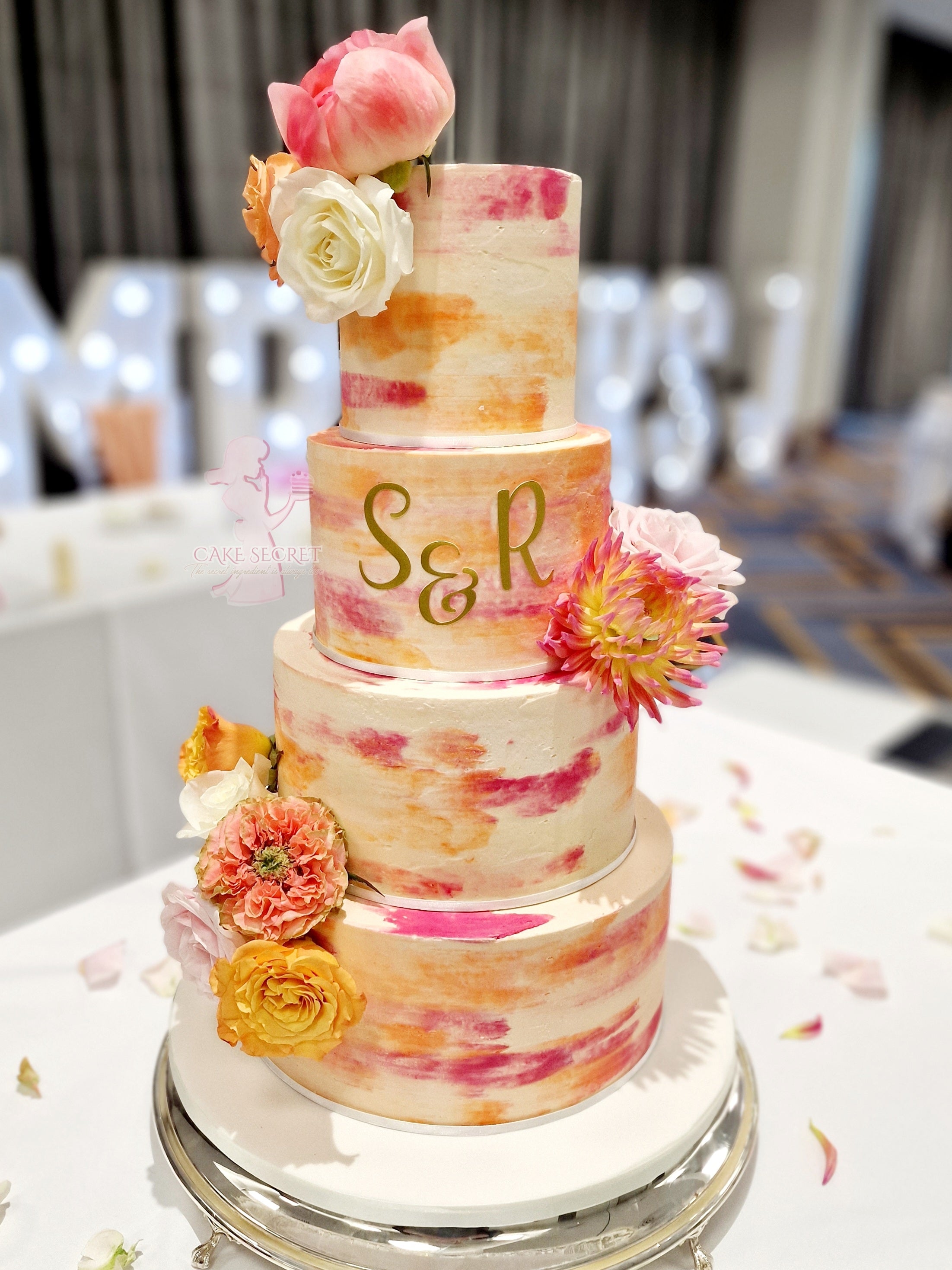 Vibrant Bliss Bright Orange and Deep Pink Textured Buttercream Wedding Cake with Fresh Flowers - Cake Secret