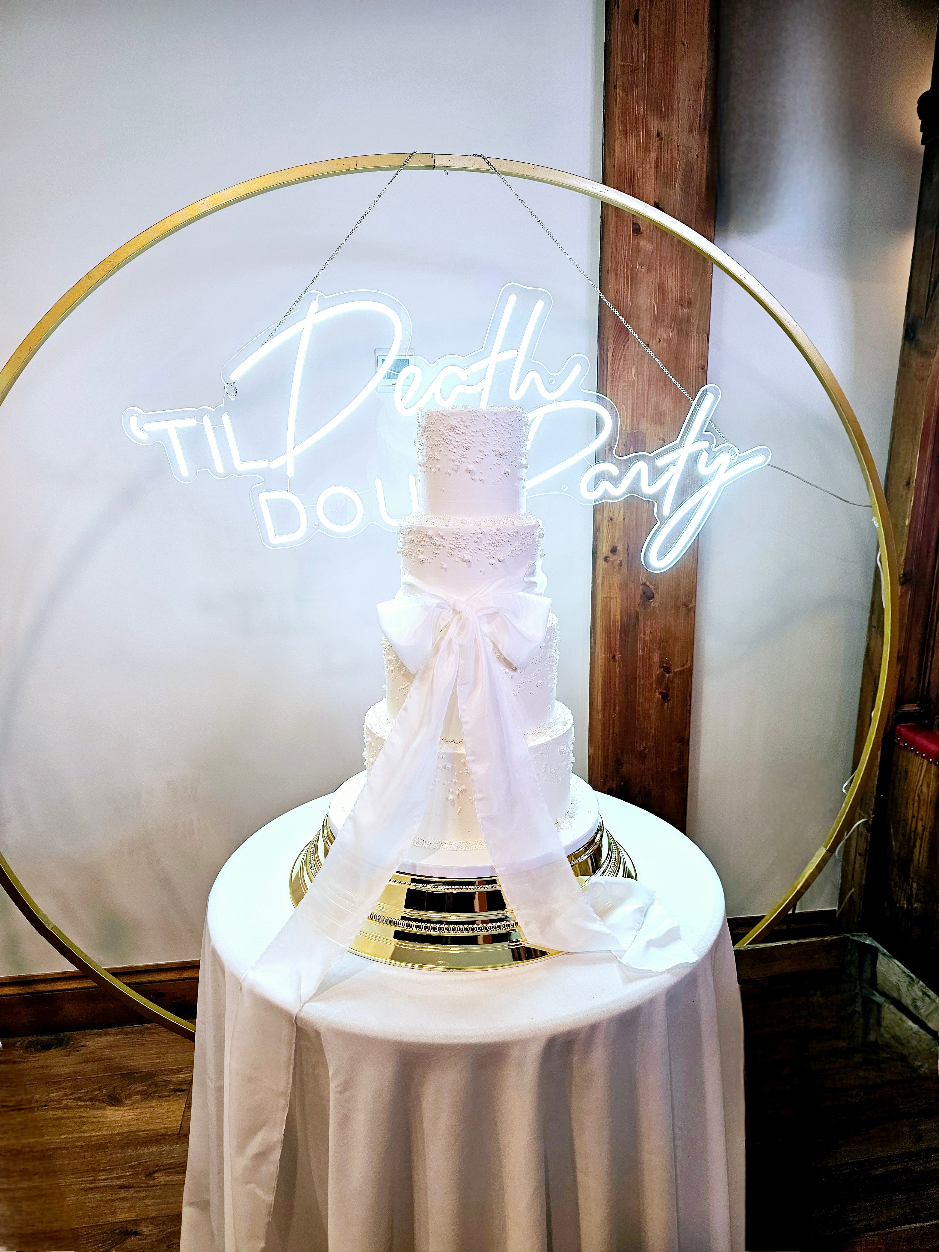 Elegant 4-Tier Buttercream Wedding Cake with Silk Bow and Sugar Pearls - Cake Secret