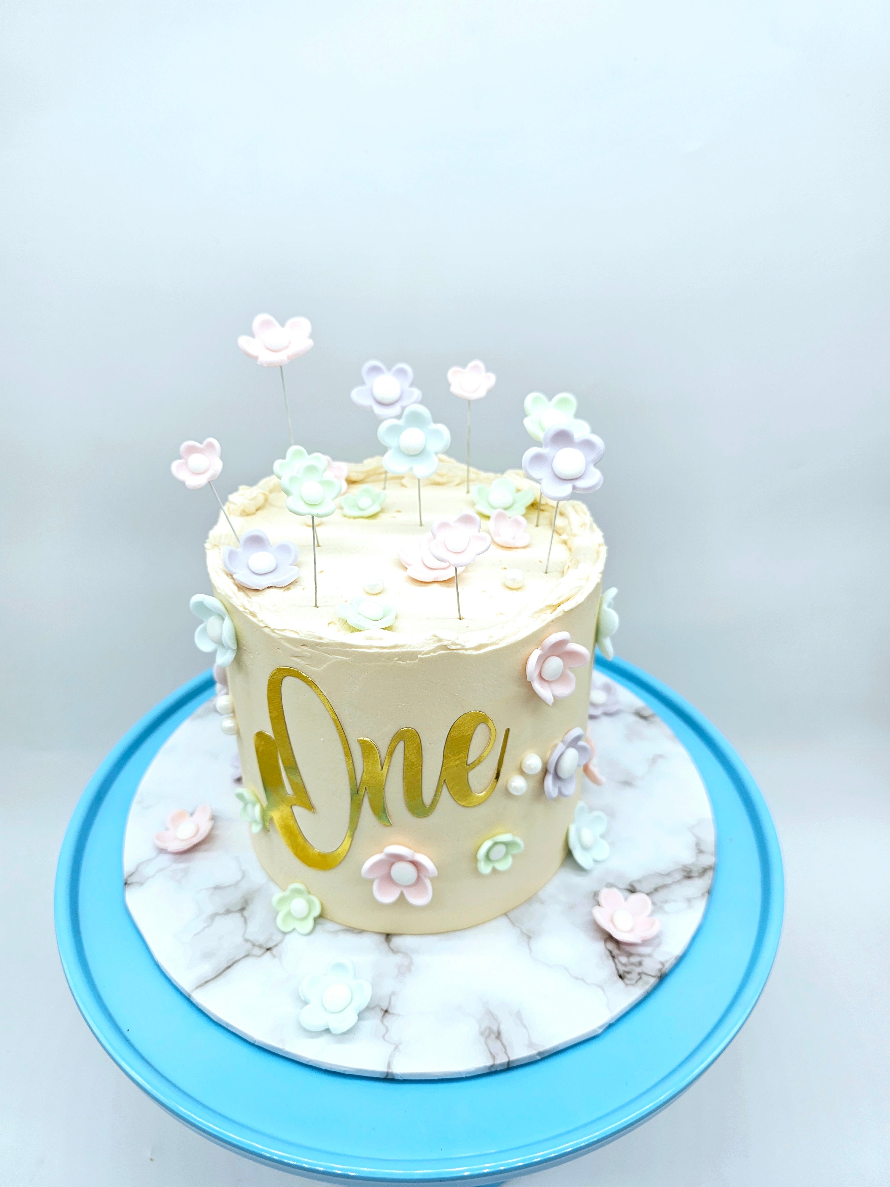 Pastel Daisy 1st Birthday Cake