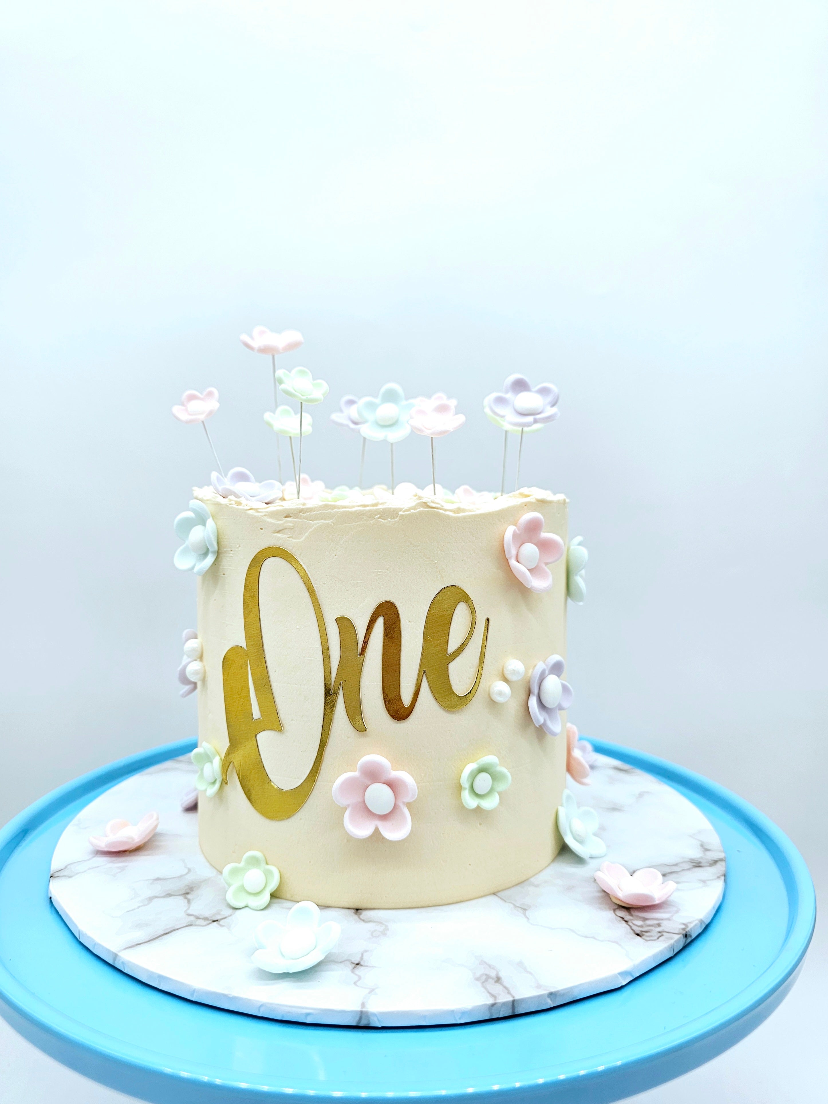 Pastel Daisy 1st Birthday Cake