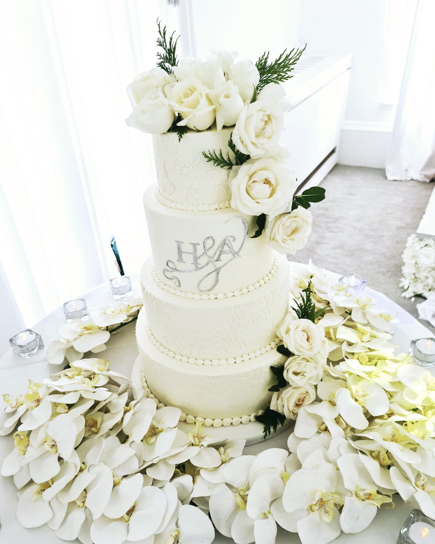 Timeless Love Elegant White Buttercream Wedding Cake with Initials and Fresh Flowers