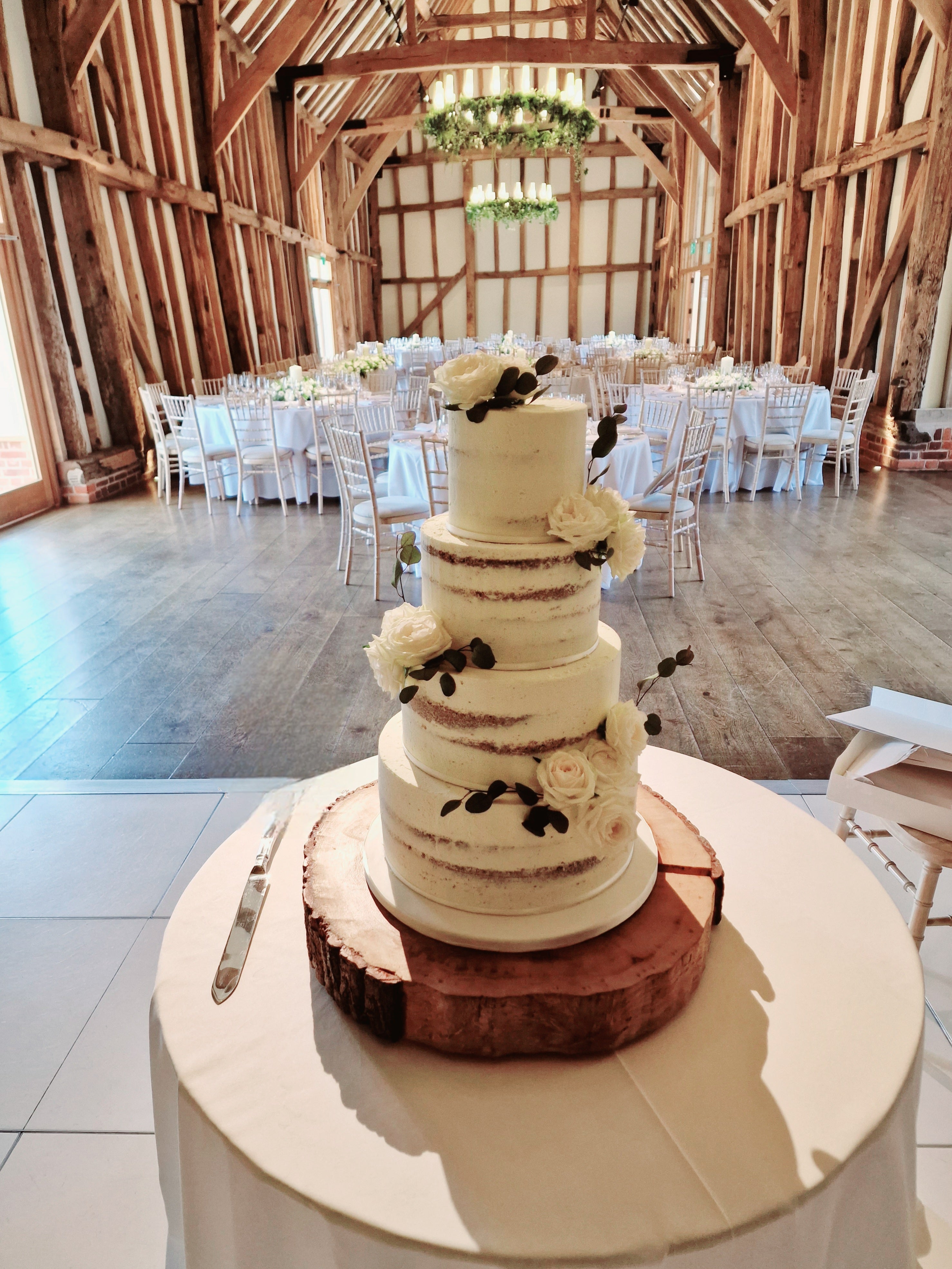 Rustic Romance Semi-Naked Wedding Cake adorned With Fresh Flowers - Cake Secret