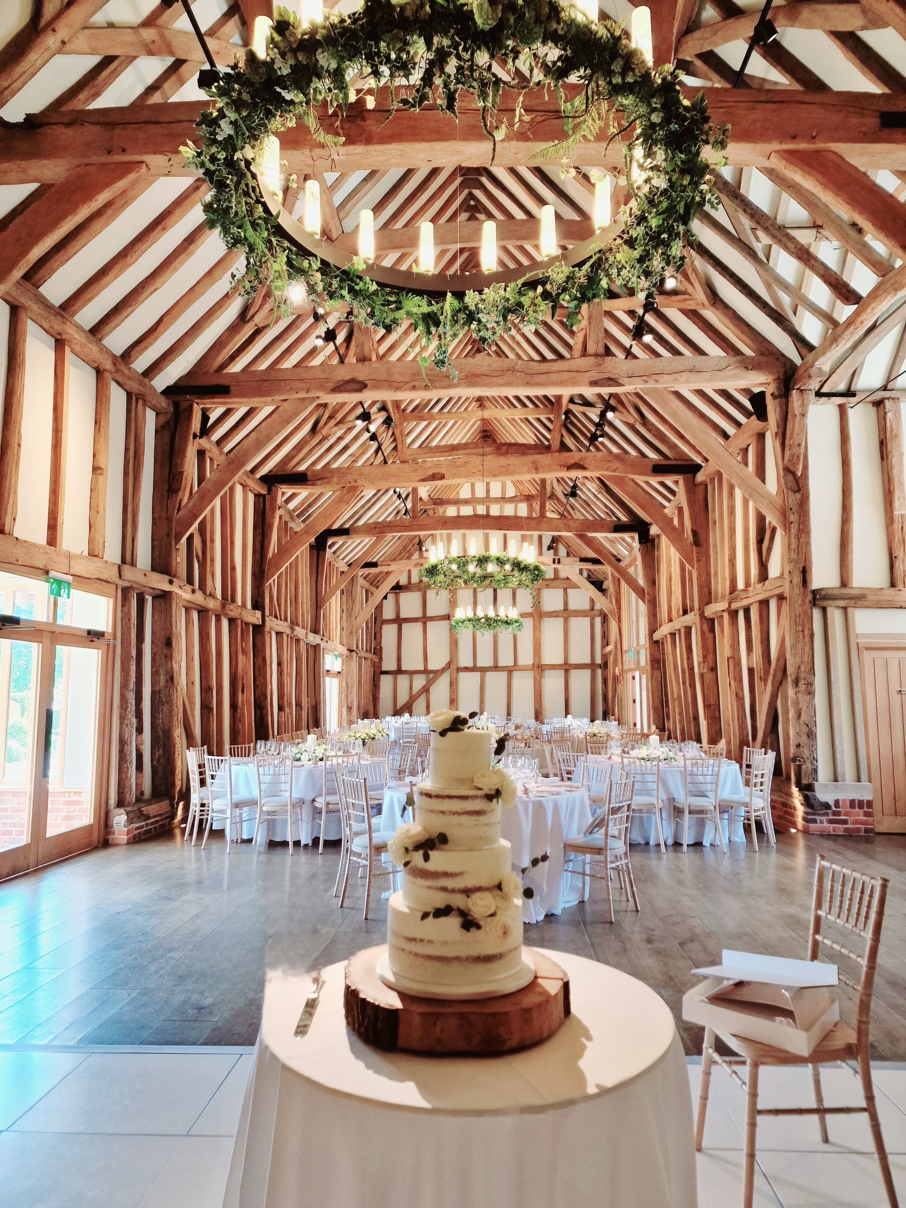 Rustic Romance Semi-Naked Wedding Cake adorned With Fresh Flowers - Cake Secret