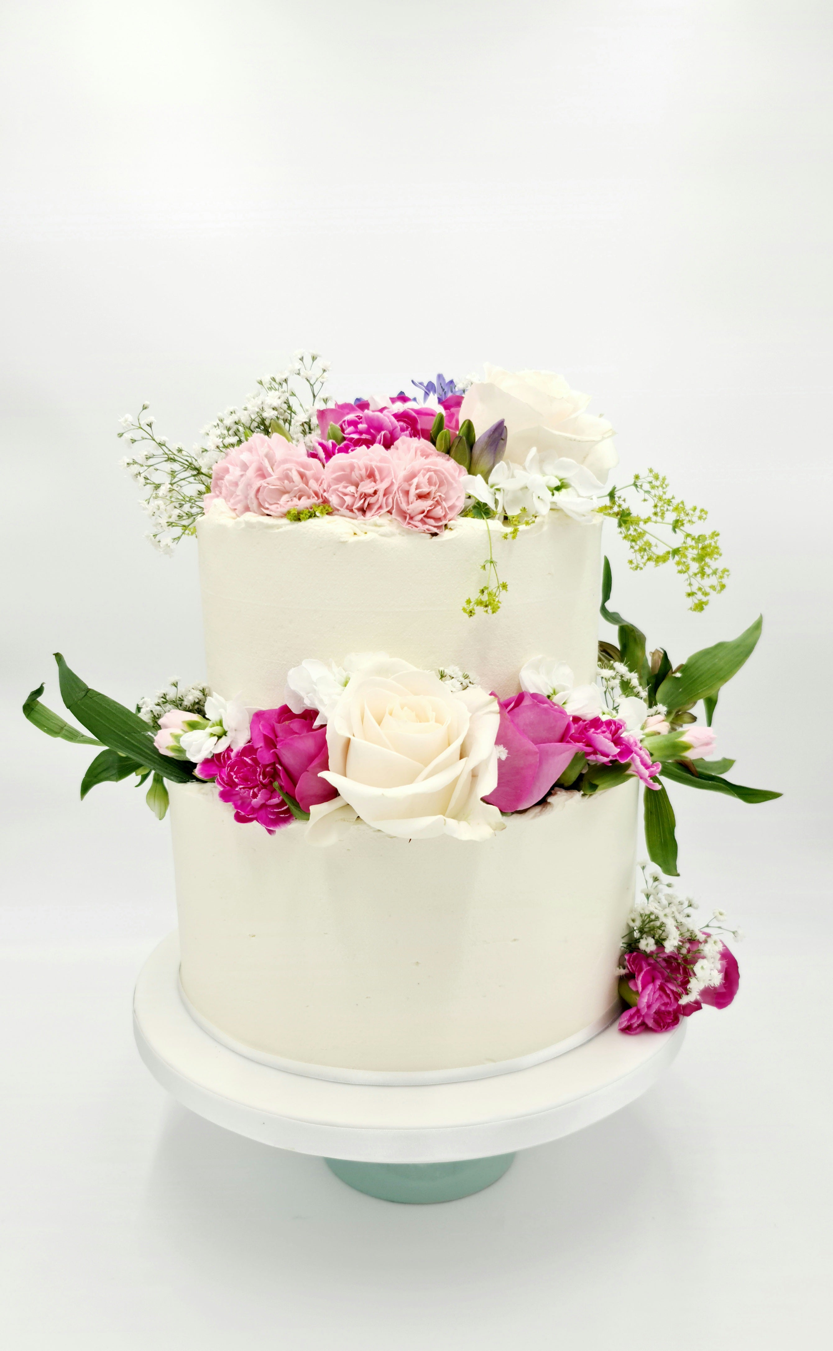 Simplicity in Elegance 2-Tier Buttercream Wedding Cake with Fresh Flowers - Cake Secret