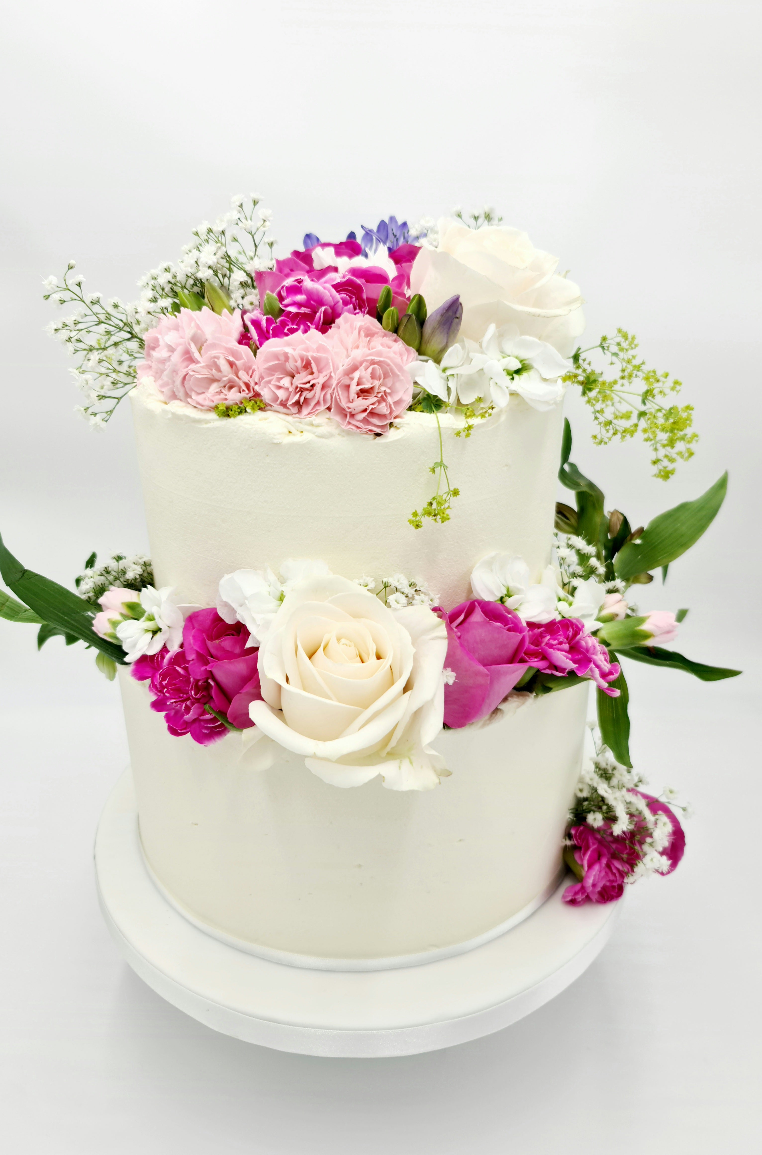Simplicity in Elegance 2-Tier Buttercream Wedding Cake with Fresh Flowers - Cake Secret
