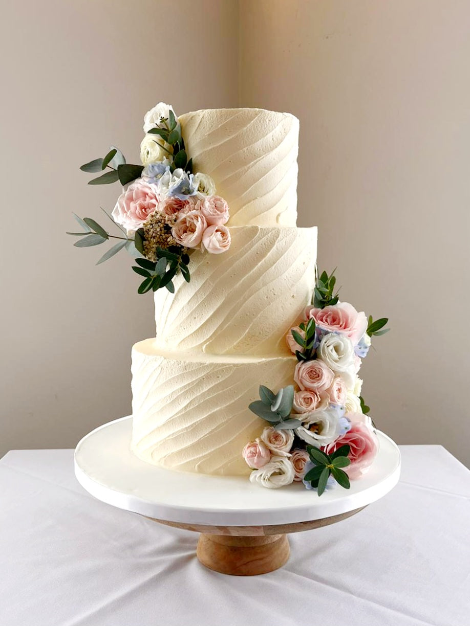 Whimsical Bloom Buttercream Wedding Cake - Cake Secret