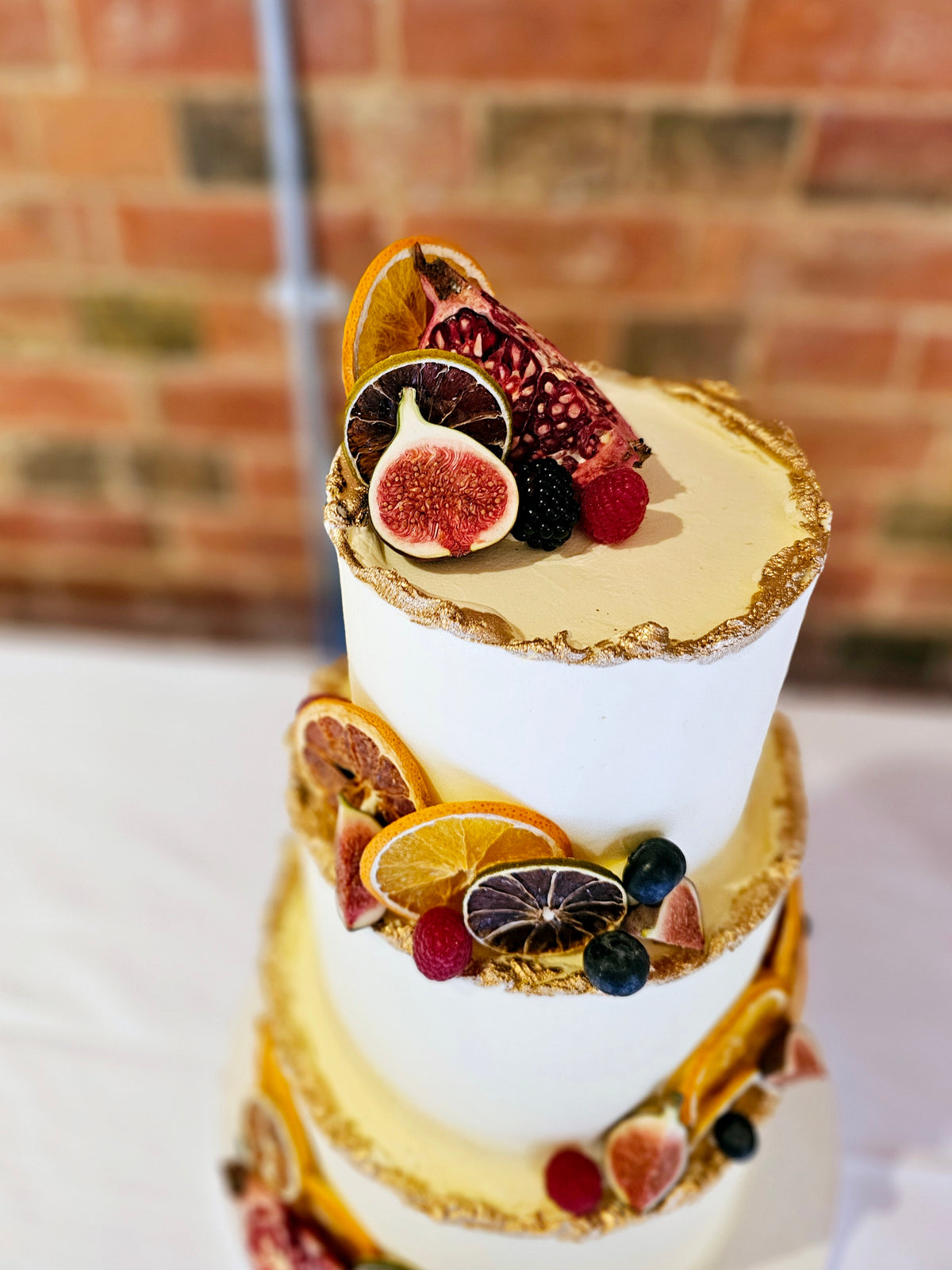 Rustic Buttercream Wedding Cake with Seasonal Fruits and Gold Accents ...