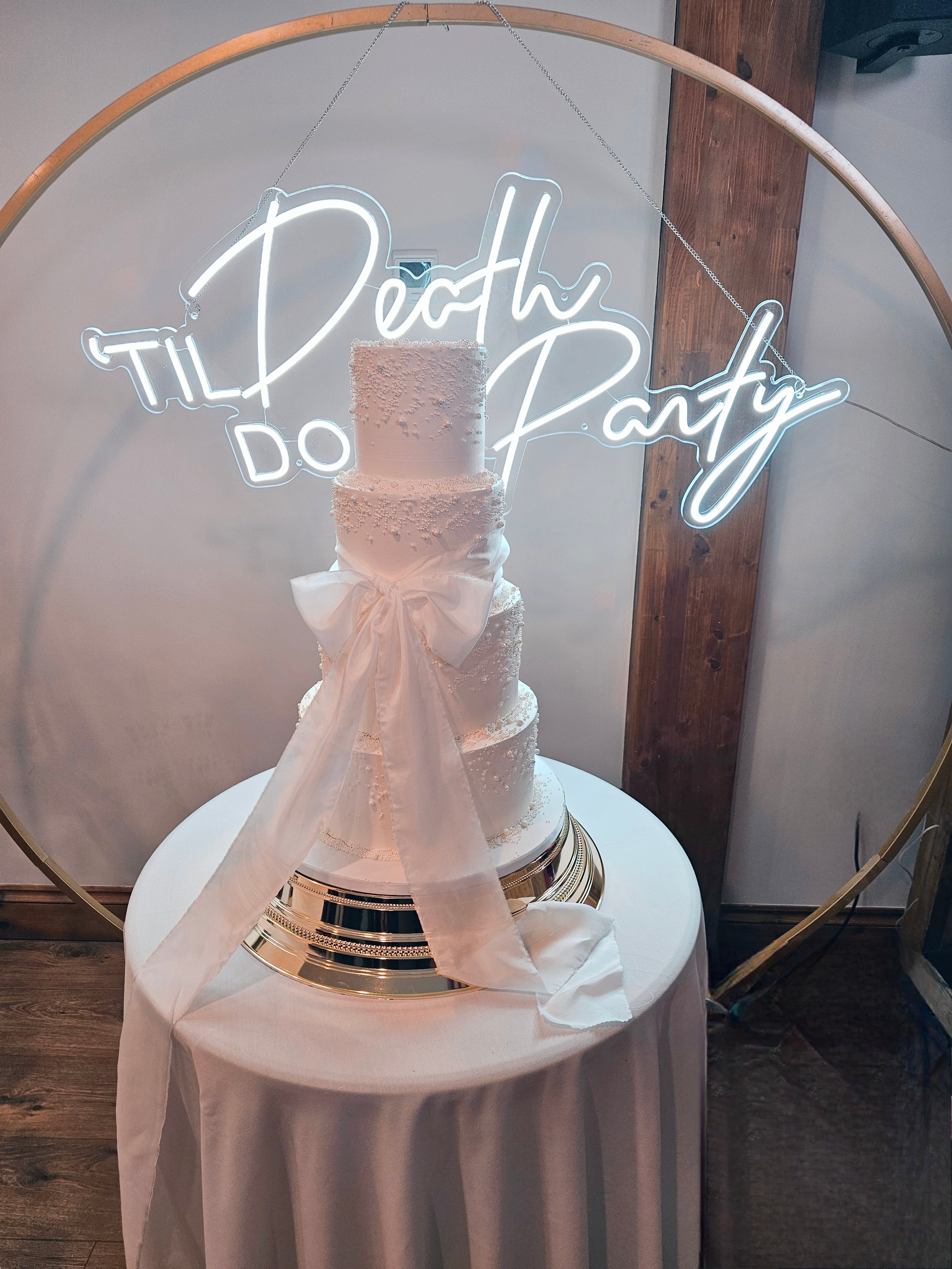 Elegant 4-Tier Buttercream Wedding Cake with Silk Bow and Sugar Pearls - Cake Secret