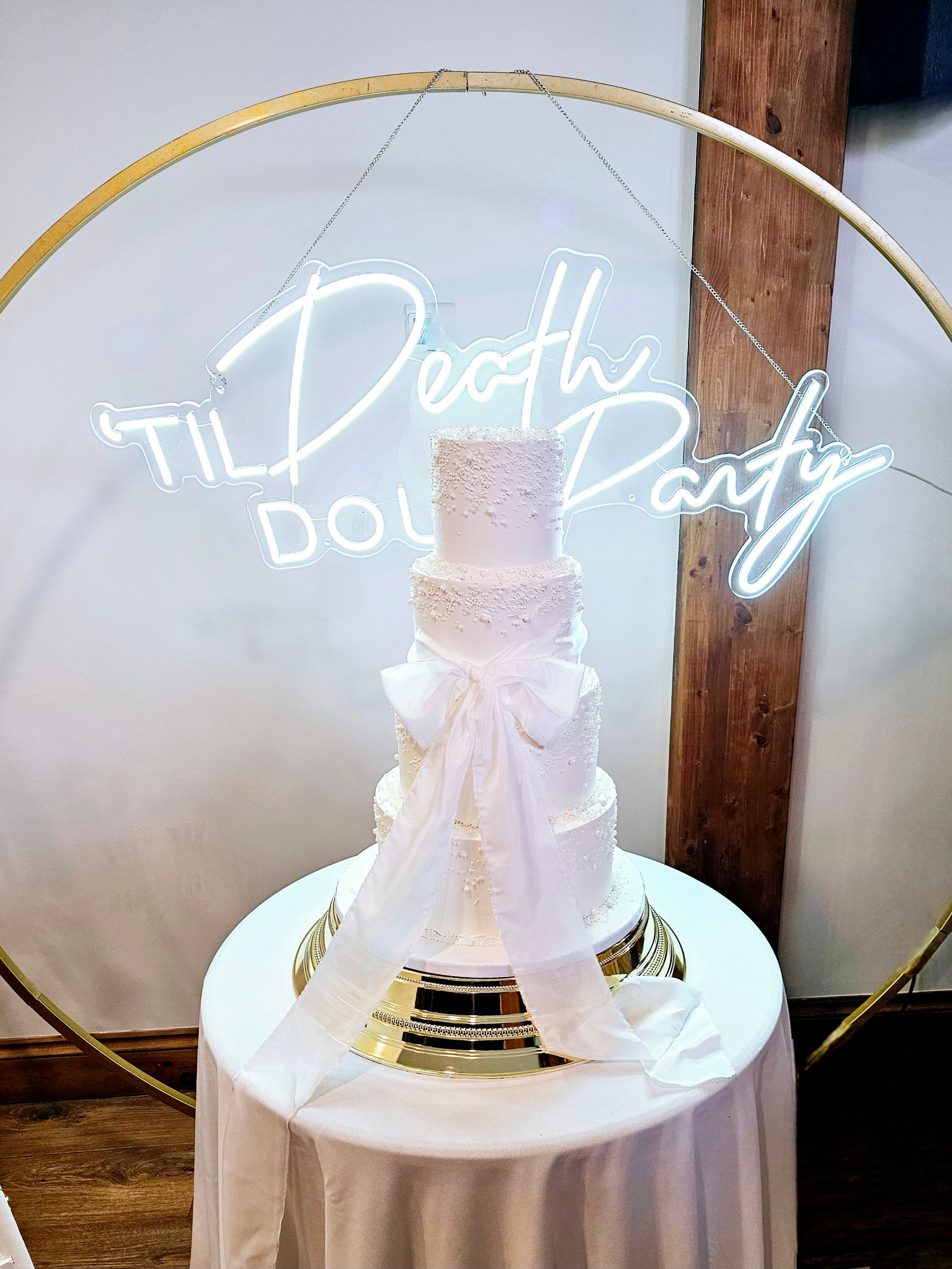 Elegant 4-Tier Buttercream Wedding Cake with Silk Bow and Sugar Pearls - Cake Secret