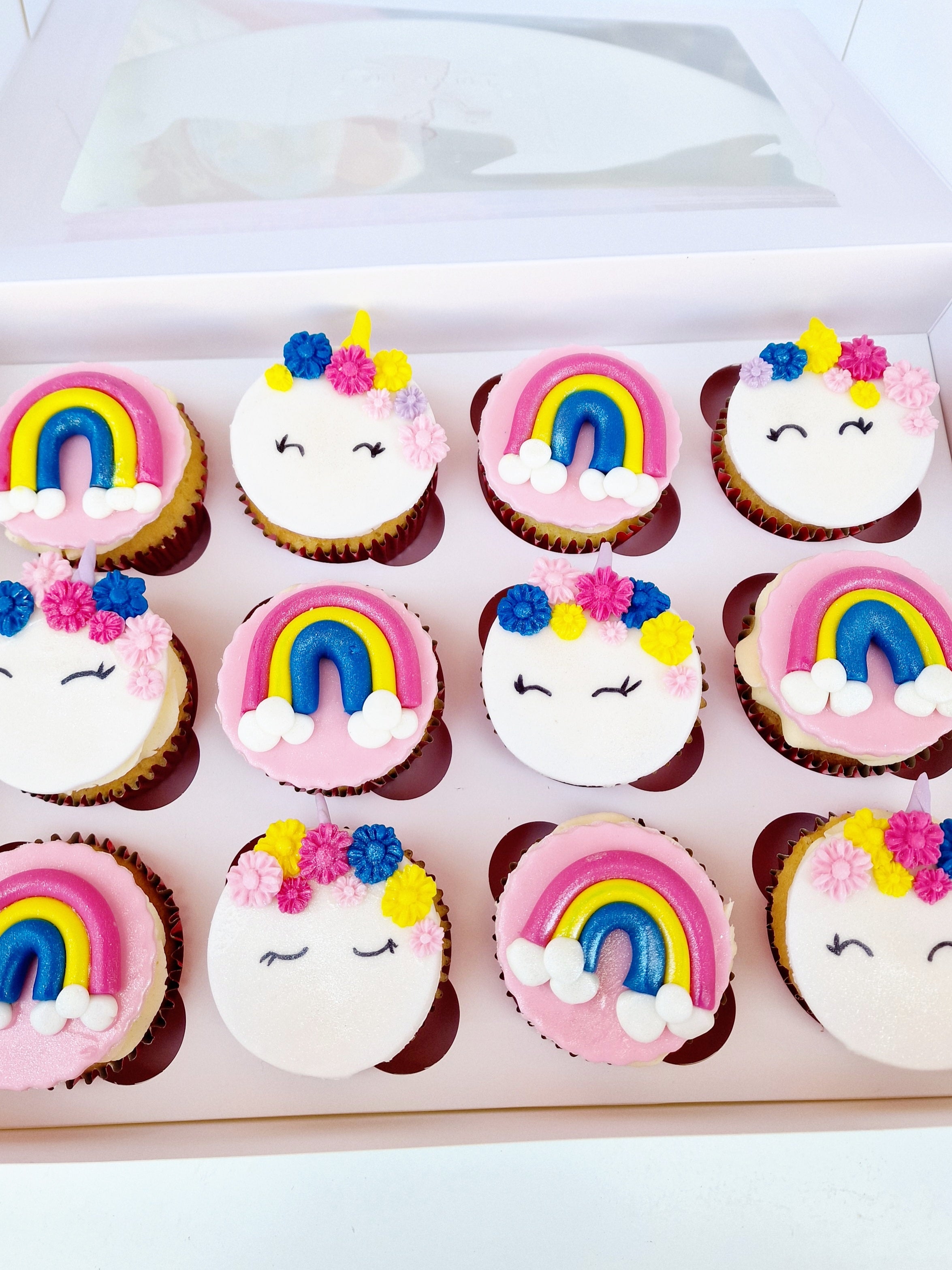 Magical Whimsy Unicorn Cupcakes Adorned with Vibrant Rainbows - Cake Secret