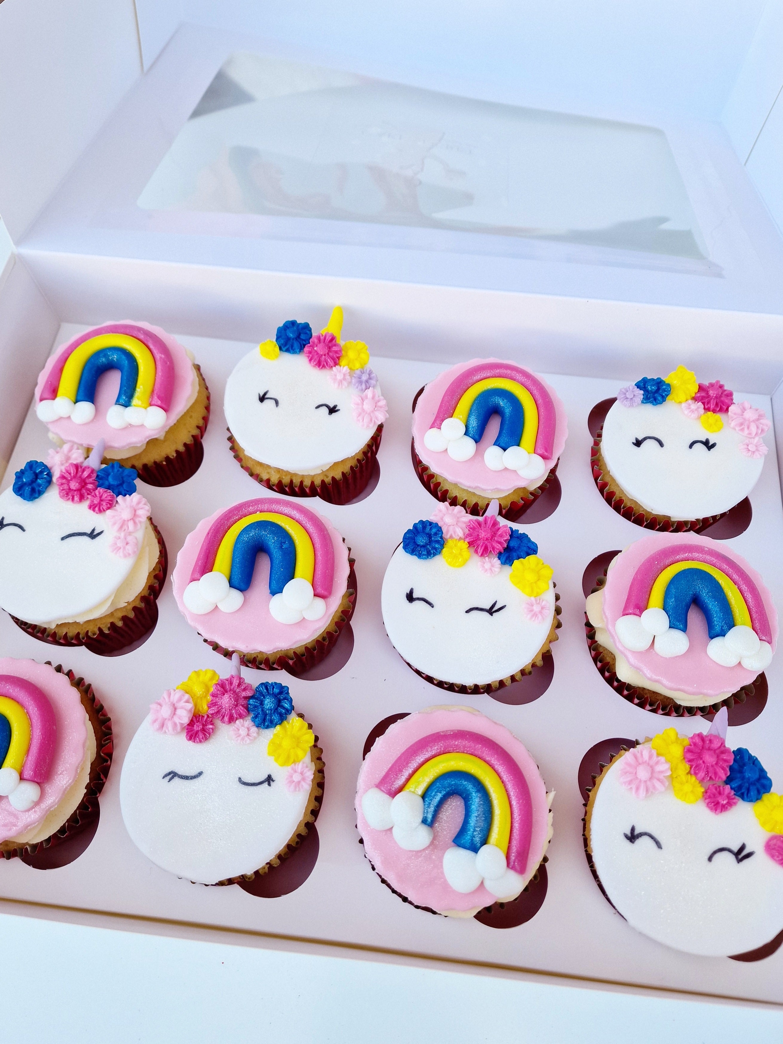 Magical Whimsy Unicorn Cupcakes Adorned with Vibrant Rainbows - Cake Secret